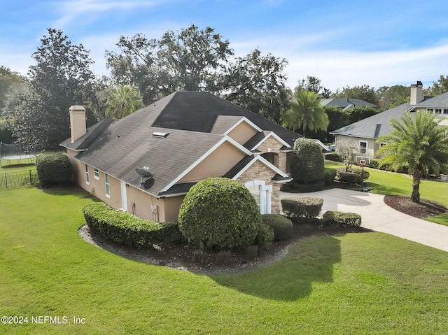 view of side of home featuring a lawn