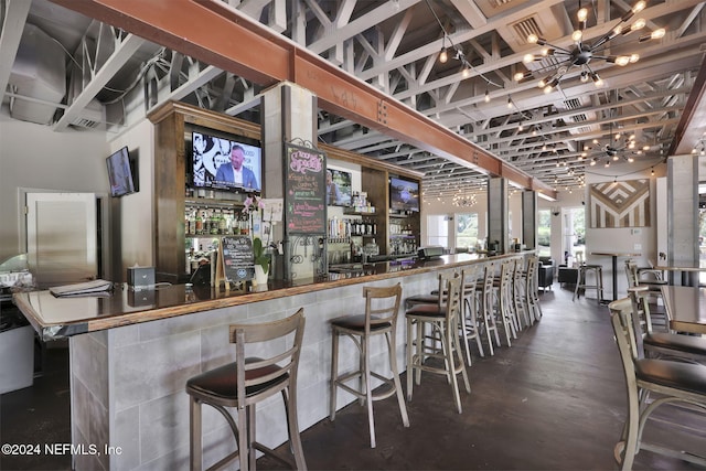 bar with a notable chandelier