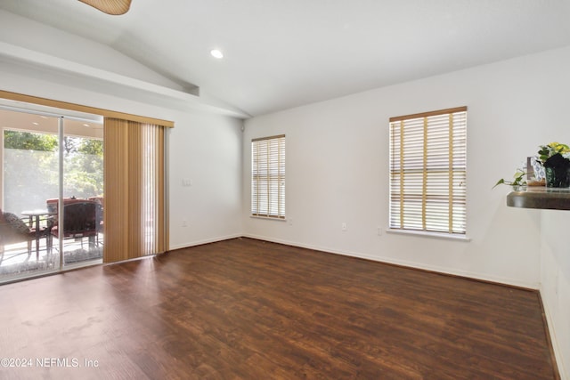 unfurnished room featuring ceiling fan, dark hardwood / wood-style flooring, and lofted ceiling