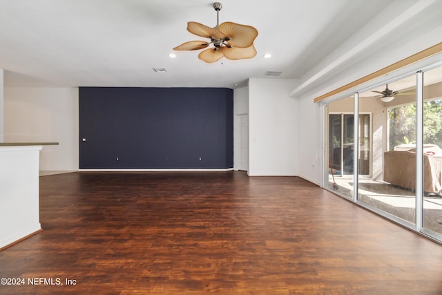 unfurnished living room featuring a ceiling fan, wood finished floors, recessed lighting, and baseboards