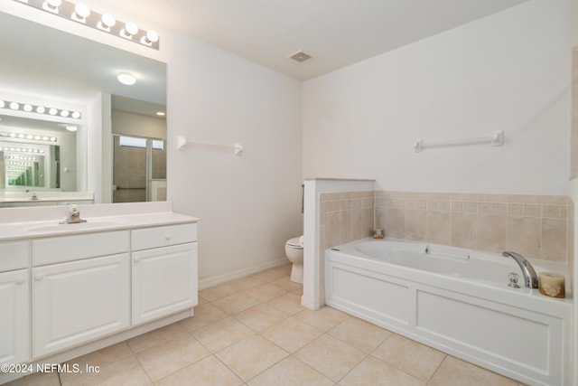 full bath with tile patterned floors, toilet, a garden tub, vanity, and an enclosed shower