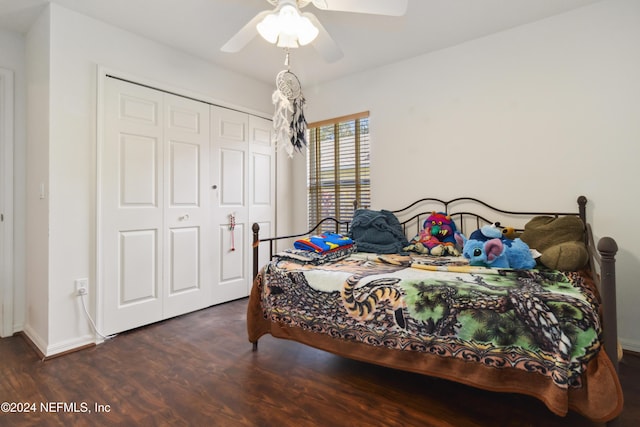 bedroom featuring wood finished floors, a closet, a ceiling fan, and baseboards