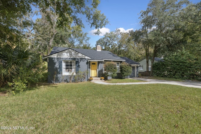 ranch-style house with a front yard