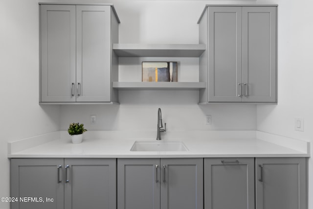 kitchen featuring gray cabinetry and sink