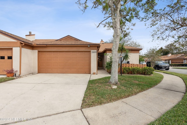 single story home featuring a garage