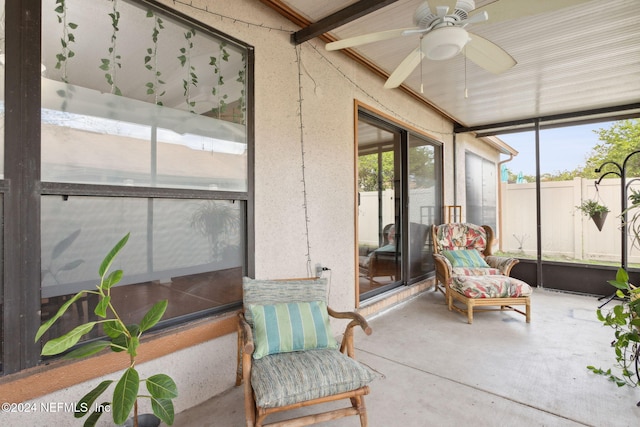 sunroom featuring ceiling fan