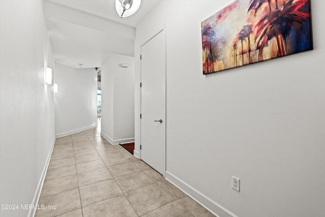 corridor with light tile patterned floors