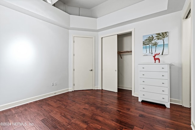 unfurnished bedroom featuring dark hardwood / wood-style floors