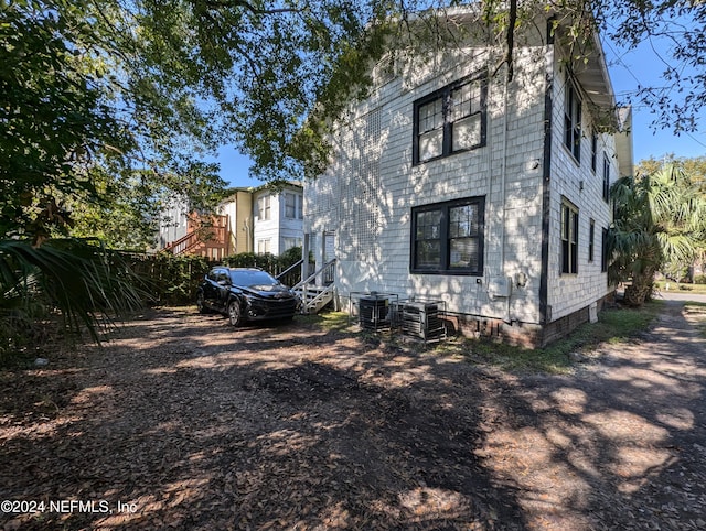 view of side of property with central AC unit