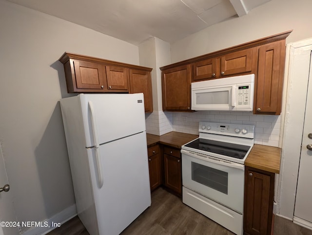 kitchen with dark hardwood / wood-style flooring, white appliances, and backsplash