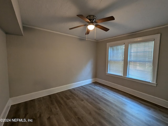 empty room featuring crown molding, ceiling fan, and dark hardwood / wood-style floors