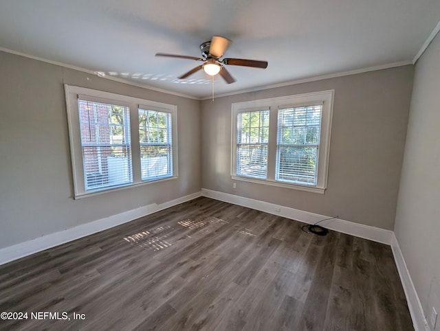 unfurnished room with a wealth of natural light, dark wood-type flooring, and ornamental molding