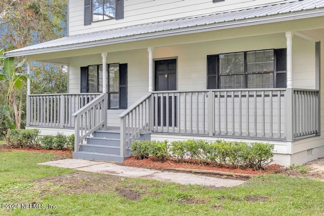 entrance to property with a porch