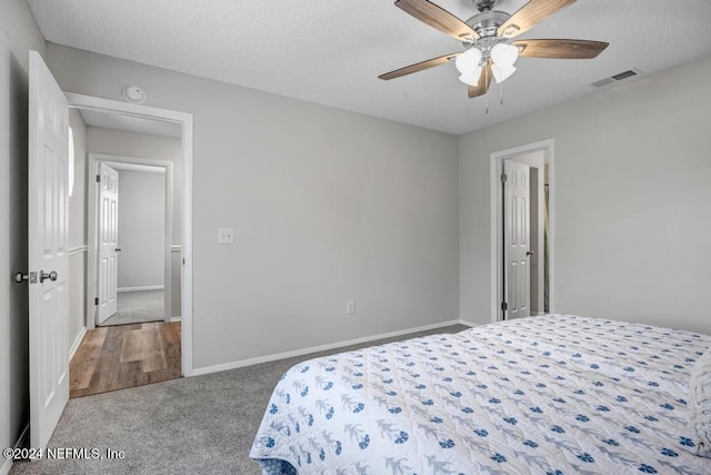 bedroom with ceiling fan and carpet floors