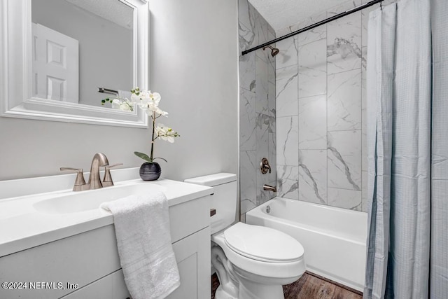 full bathroom with wood-type flooring, a textured ceiling, toilet, shower / bath combo with shower curtain, and vanity