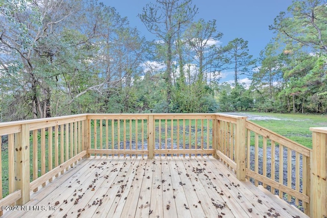 wooden terrace with a yard