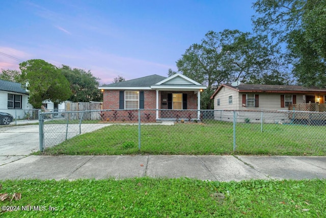 view of front of home featuring a lawn