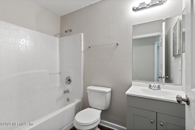 full bathroom with vanity, shower / bathing tub combination, toilet, and a textured ceiling