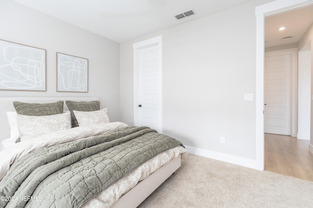 bedroom with light hardwood / wood-style floors