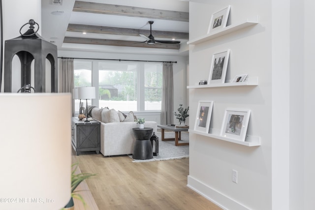 living room with beam ceiling, ceiling fan, and light hardwood / wood-style floors