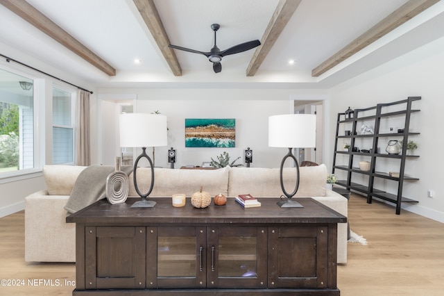 bar featuring ceiling fan, dark brown cabinets, beamed ceiling, and light hardwood / wood-style floors