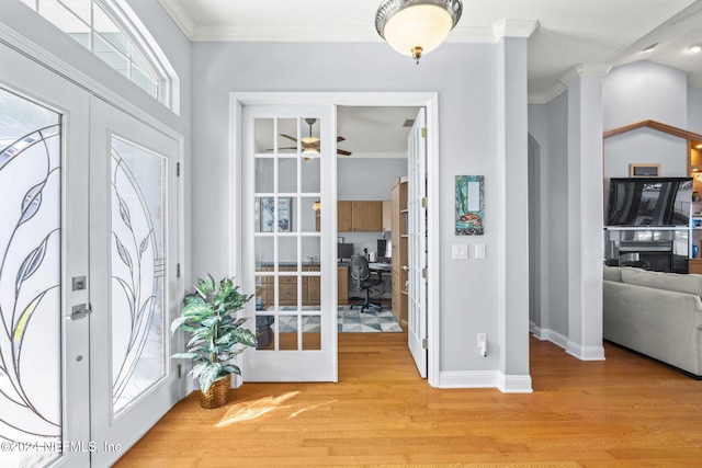 foyer entrance with crown molding, french doors, ceiling fan, and light hardwood / wood-style flooring