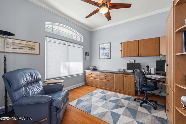 home office with ceiling fan, ornamental molding, and light hardwood / wood-style flooring