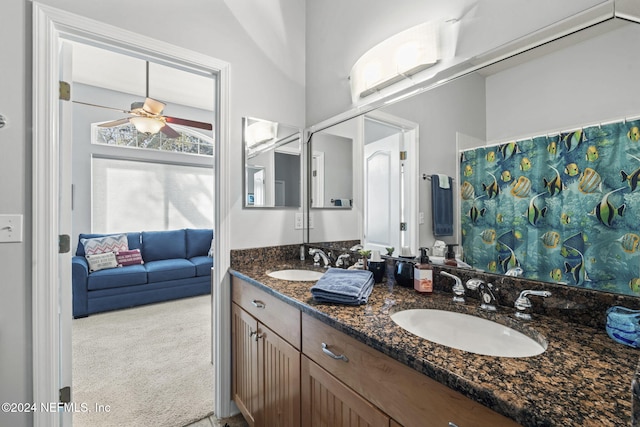 bathroom with ceiling fan and vanity