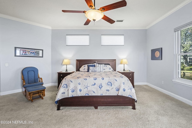 bedroom featuring ceiling fan, light carpet, and ornamental molding