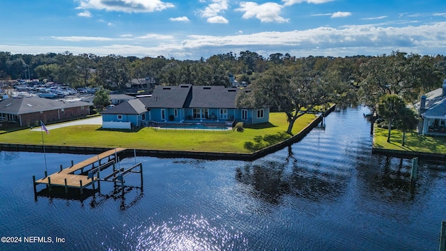 dock area featuring a water view and a lawn