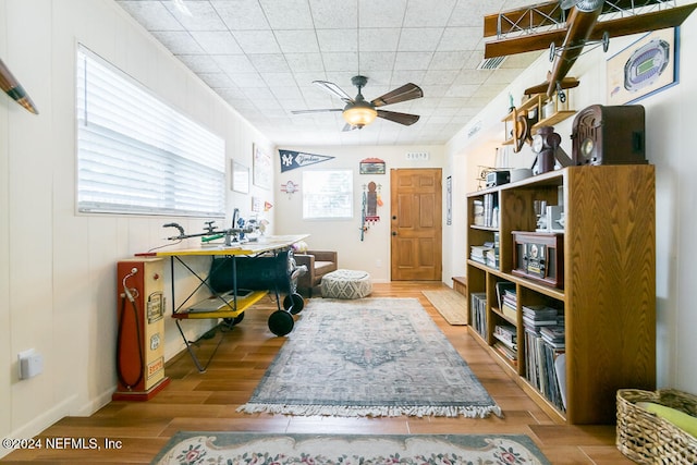 sitting room featuring ceiling fan and light wood-type flooring