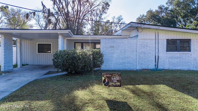 view of property exterior featuring a yard and a carport