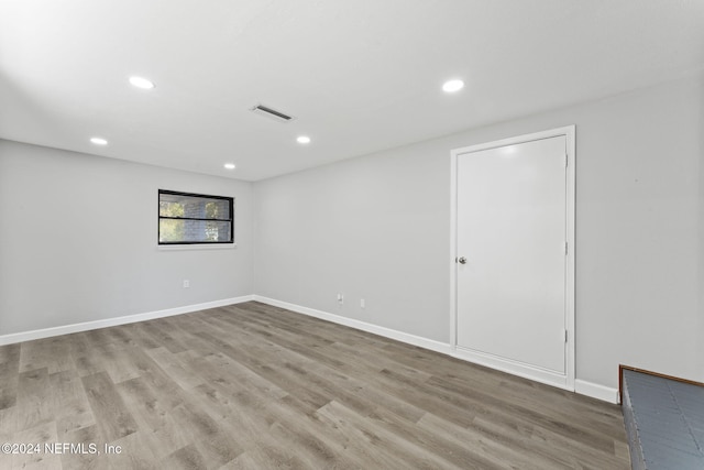 spare room with hardwood / wood-style floors