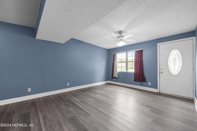 entryway with wood-type flooring, a textured ceiling, and ceiling fan