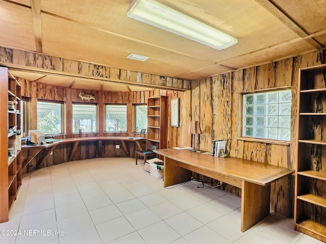 office space featuring wood walls