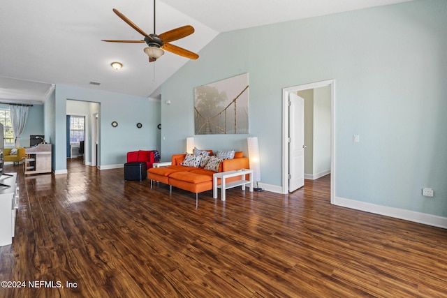 sitting room with ceiling fan, dark wood-type flooring, and vaulted ceiling