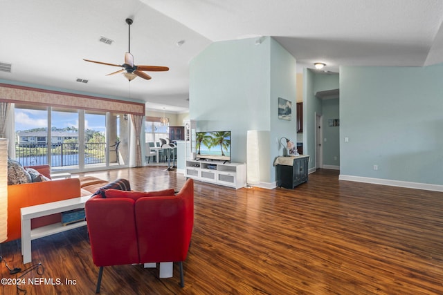 living room with ceiling fan, dark hardwood / wood-style flooring, and lofted ceiling