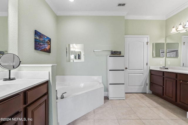 bathroom with vanity, tile patterned floors, ornamental molding, and a tub