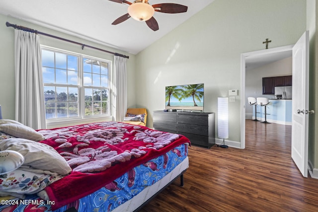 bedroom with ceiling fan, dark hardwood / wood-style flooring, lofted ceiling, and stainless steel refrigerator with ice dispenser