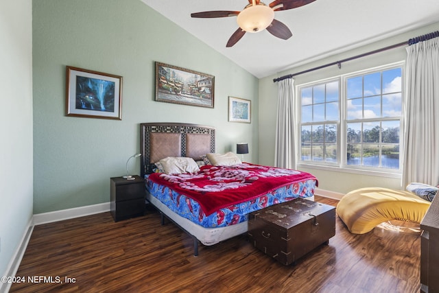 bedroom with dark wood-type flooring, ceiling fan, and lofted ceiling