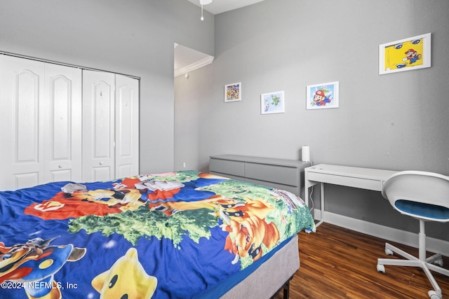 bedroom featuring dark hardwood / wood-style floors and a closet