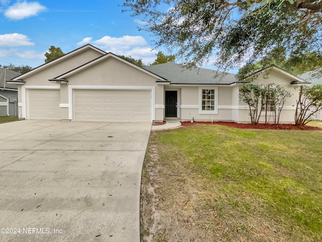 single story home featuring a front yard and a garage