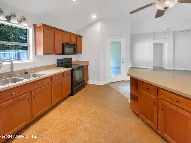 kitchen featuring light tile patterned floors, sink, ceiling fan, and black appliances