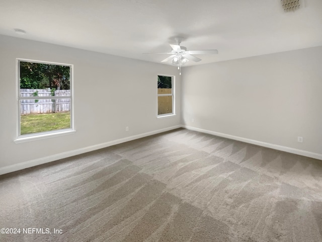 carpeted empty room with ceiling fan