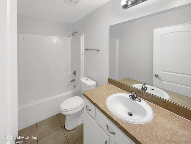 full bathroom with tile patterned flooring, bathing tub / shower combination, a textured ceiling, toilet, and vanity