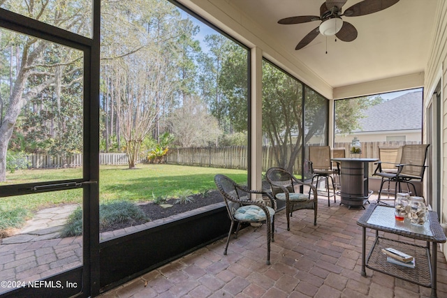 sunroom / solarium with ceiling fan