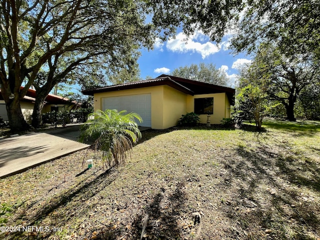 view of side of property with a garage