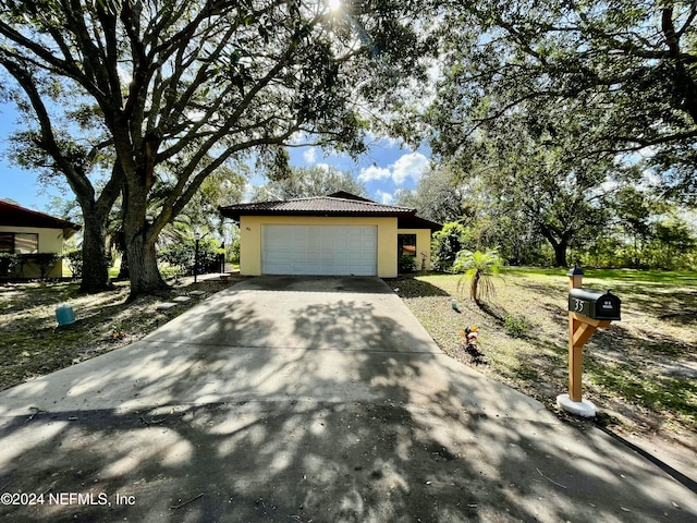 view of side of property with a garage