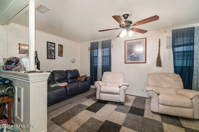 living room with ceiling fan and wood-type flooring