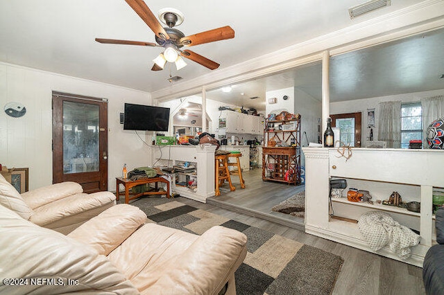 living room featuring ceiling fan and hardwood / wood-style flooring